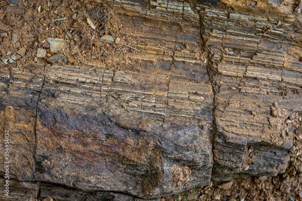 the background and rough dark stone texture closeup the background and rough dark stone texture closeup