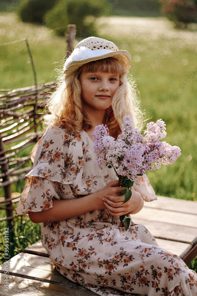 Obraz premium a little girl in a pink dress