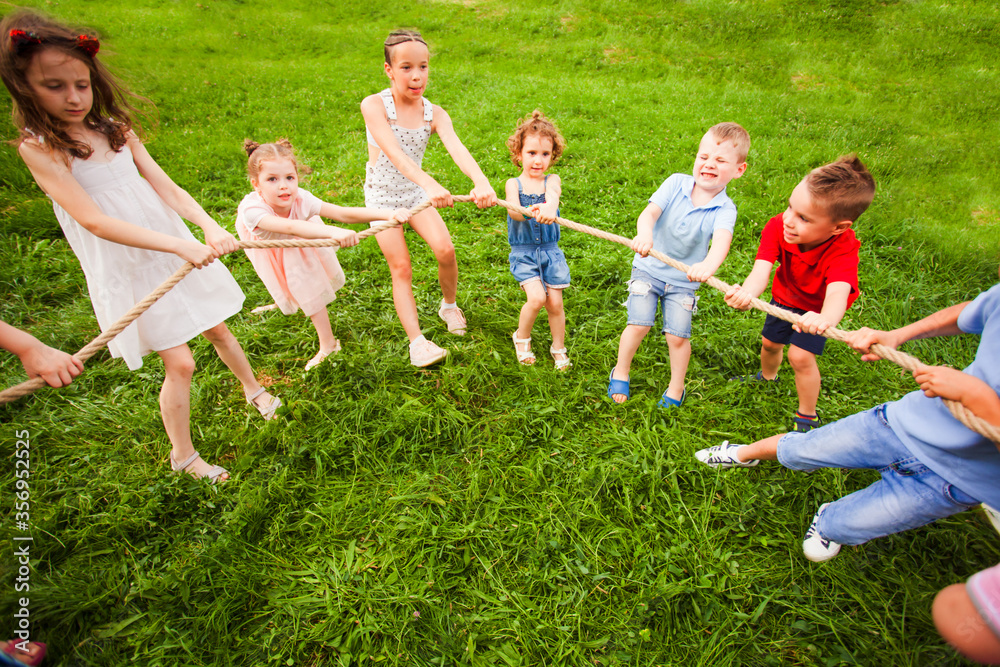 Children play with a rope in the park