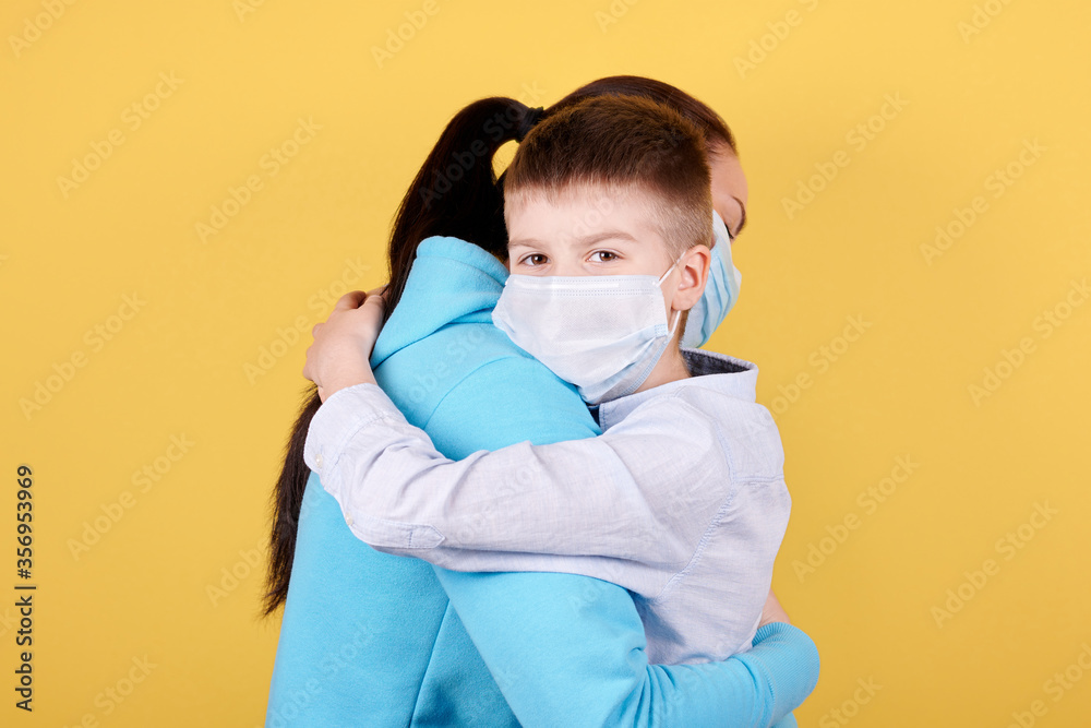 Portrait of a brunette boy and his mother, lovely hugs.