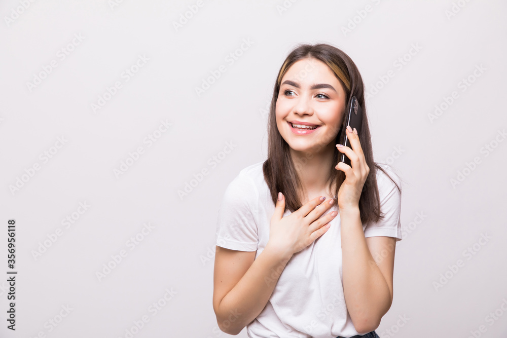 Teen girl using cell phone isolated on white background Teen girl using cell phone isolated on white background