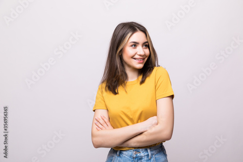 Young casual woman isolated over white background.