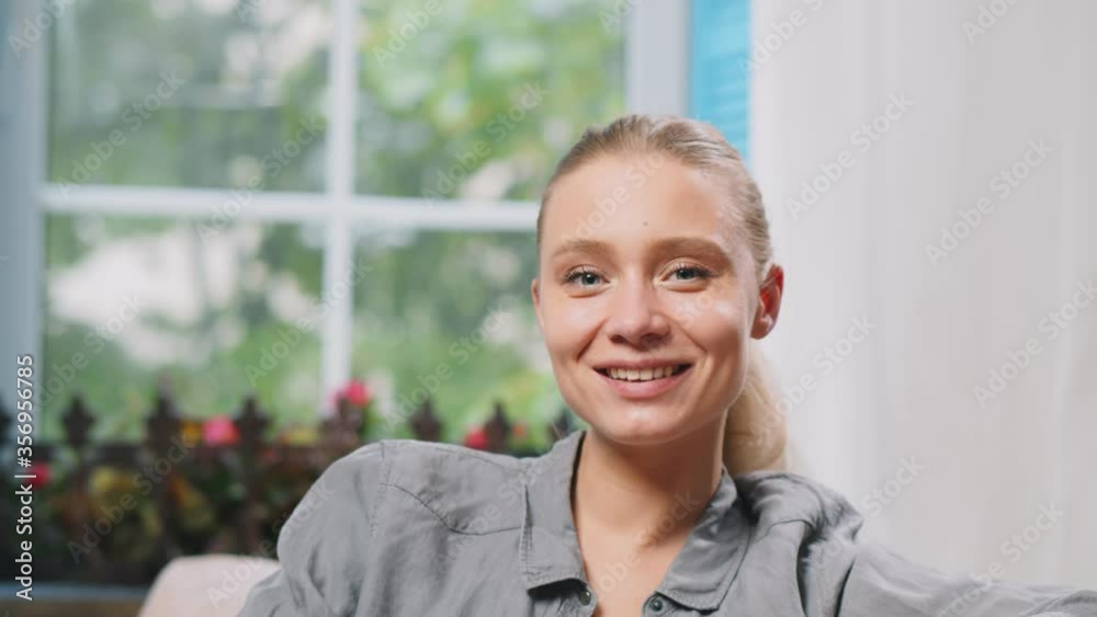 Young pretty woman having video chat sitting at home Young pretty woman having video chat sitting at home
