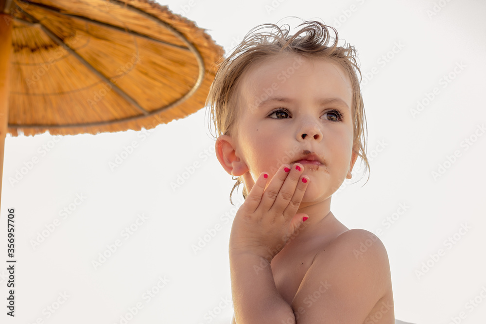 little girl eating a donut