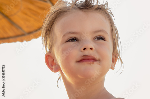 little girl eating a donut