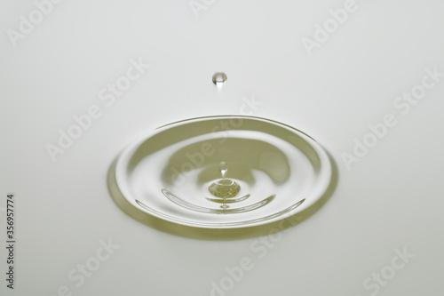 Dripping colorless oil on white background.