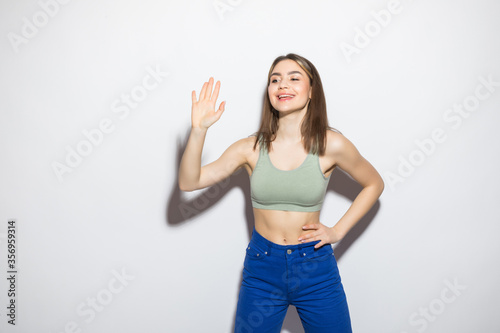 Young woman greeting with hands isolated on white background