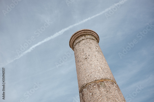Stone tower, sky with chemtrails