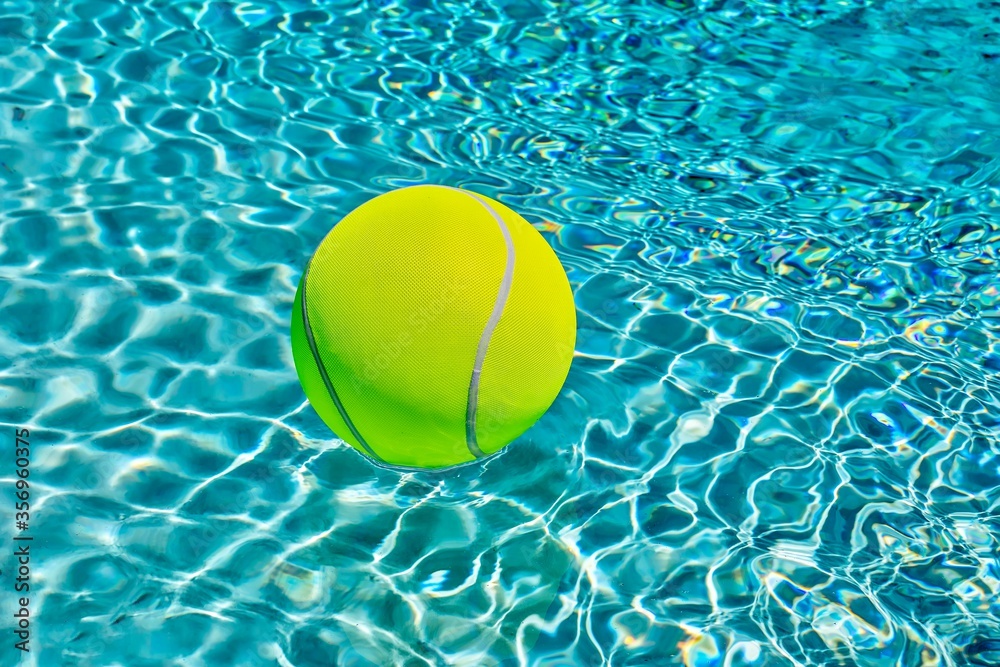  Ball In Water. Isolated. Yellow  giant ball in swimming pool, Stock Image.