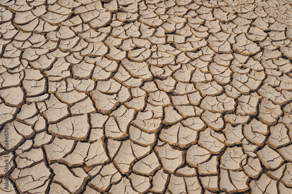 Natural Drought concept:Dried cracked earth soil ground texture background.desert rough land dry crack erosion in the ground due to drought.Dry red clay soil texture, natural floor background Natural Drought concept:Dried cracked earth soil ground texture background.desert rough land dry crack erosion in the ground due to drought.Dry red clay soil texture, natural floor background