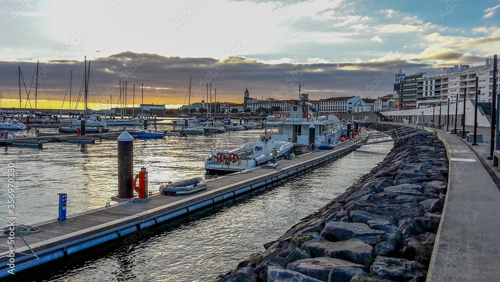 Harbor of Ponta Delgada, capital of the Azores on the island of Sao Miguel, during sunset