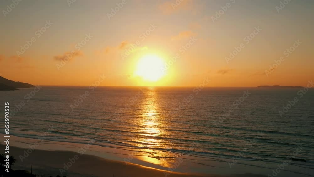 Beautiful brazilian beach sunset aerial revealing shot