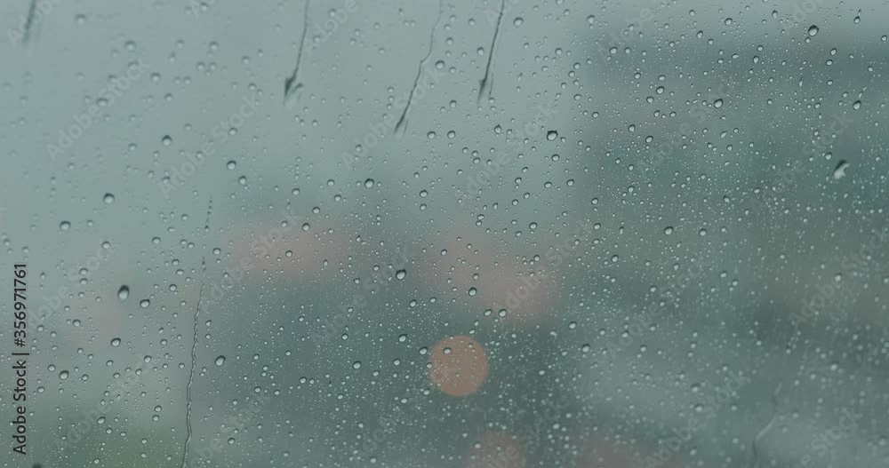 Heavy raining outside, rain on the window glass