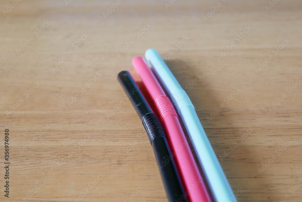 Fototapeta premium used drinking straws on blue background