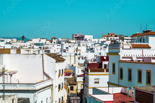 Panoramic view of a white Andalusian town on a sunny summer day in Spain. © Elle Monroe