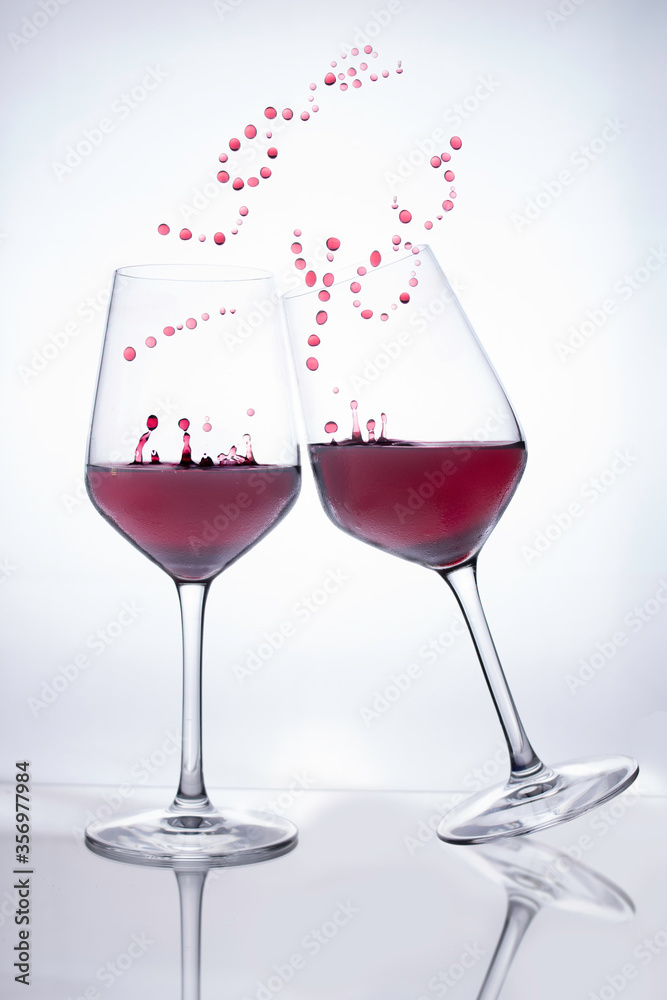 red wine glasses simulating love couple