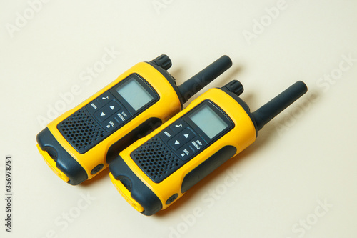 yellow walkie-talkies on a light background