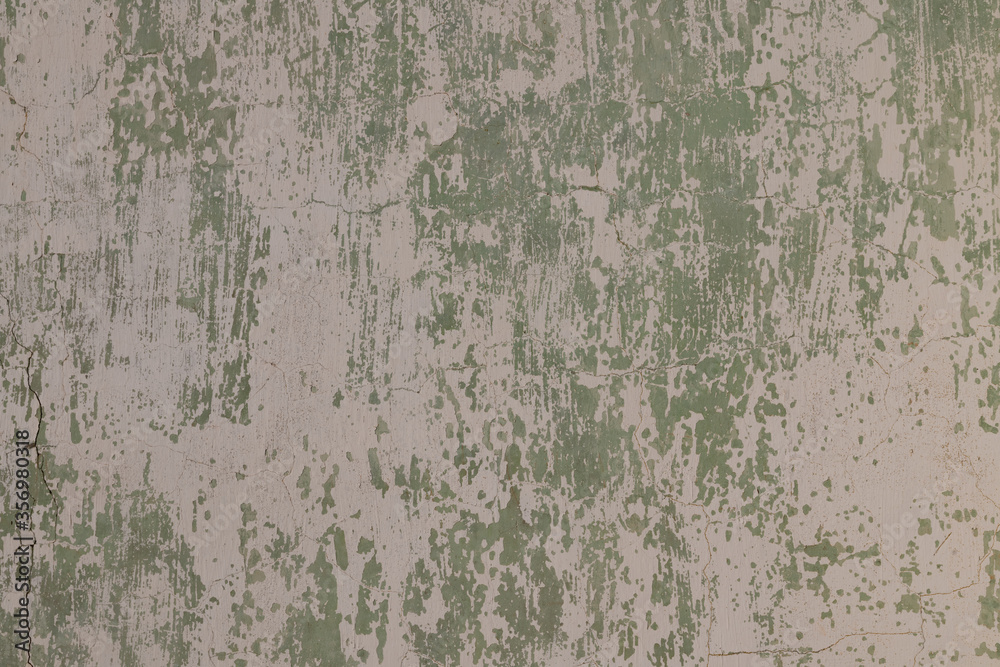 Old grungy concrete wall with peeling paint Old grungy concrete wall with peeling paint