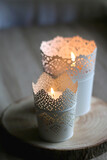 Two candle holders with lit candles. Home decor detail. Selective focus.