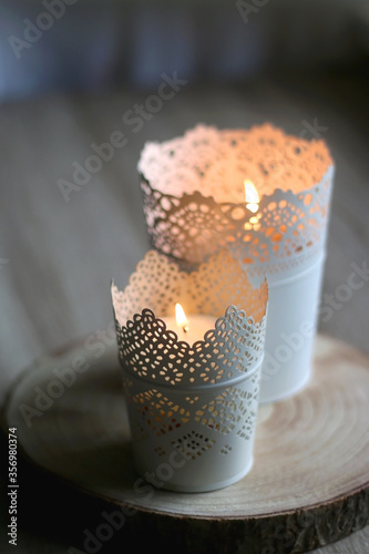Two candle holders with lit candles. Home decor detail. Selective focus.