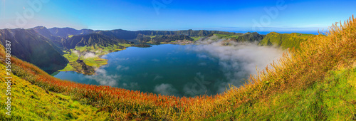Panorama of the crater lake Lagoa do fog, famous hiking oportunity at the island of Sao Miguel, Azores islands, Portugal photo