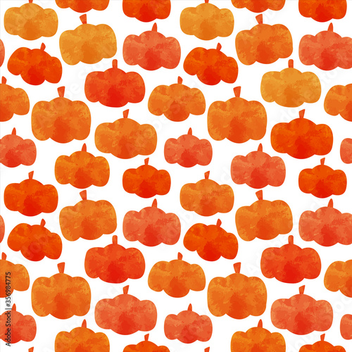 Cute orange pumpkin seamless pattern in hand drawn watercolor style. Autumn background with vegetables and leaves for thanksgiving or fall season concept.