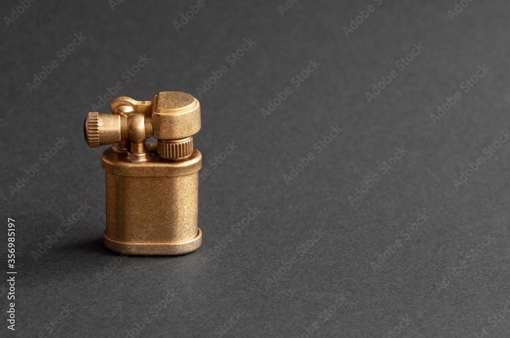 old petrol lighter. isolated on black background. place for inscription. old petrol lighter. isolated on black background. place for inscription.