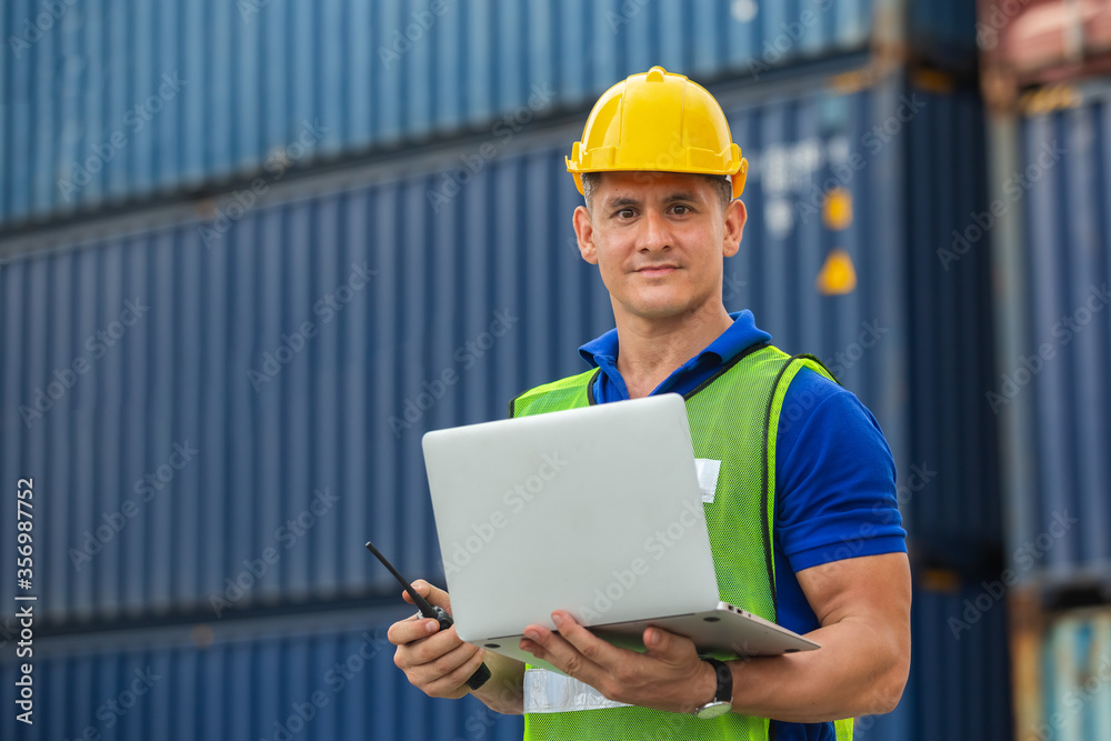 Foreman radio communication and laptop in shipping yard, for logistics and import export company. business logistics concept. Foreman radio communication and laptop in shipping yard, for logistics and import export company. business logistics concept.