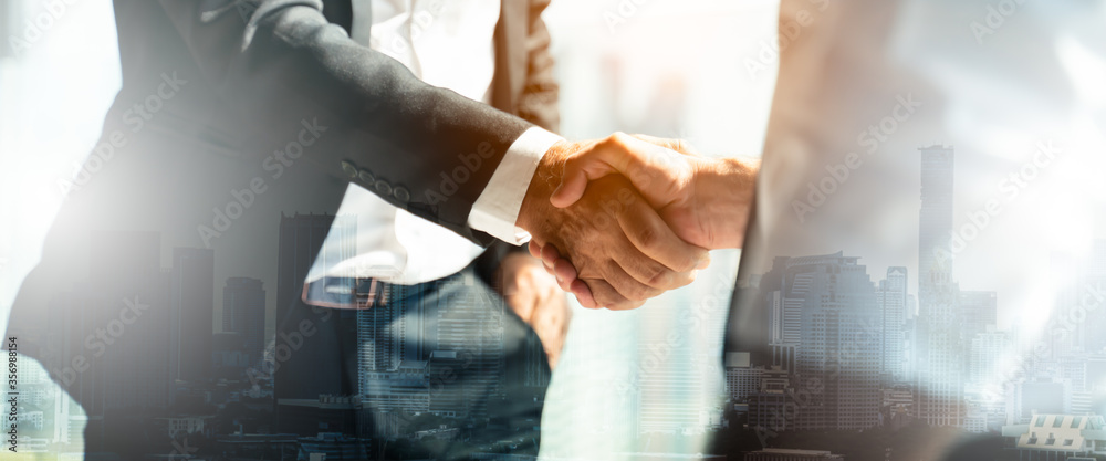 Businessman handshake for teamwork of business merger and acquisition,successful negotiate,hand shake,two businessman shake hand with partner to celebration partnership and business deal concept