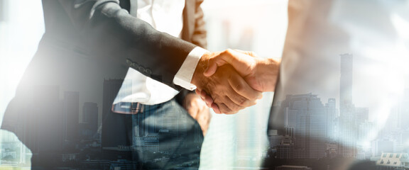 Businessman handshake for teamwork of business merger and acquisition,successful negotiate,hand shake,two businessman shake hand with partner to celebration partnership and business deal concept