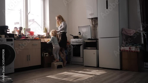Mother and daughter preparing cookies in the kitchen