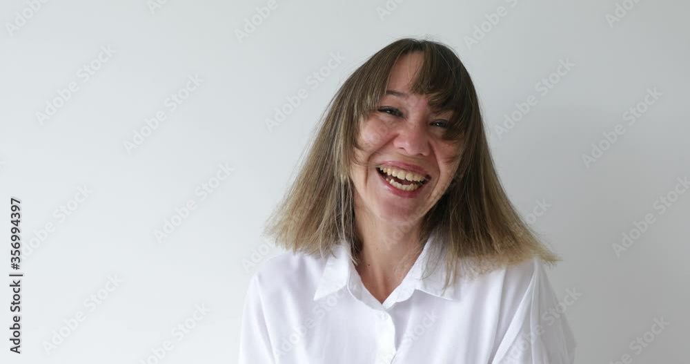 Portrait young woman looking at camera with happy emotion enjoying successful lifestyle on white background Portrait young woman looking at camera with happy emotion enjoying successful lifestyle on white background