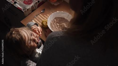 Mother and daughter preparing cookies in the kitchen