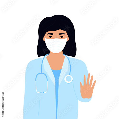 COVID-19. Coronavirus epidemic. doctor in protective medical mask. Stop virus concept. A woman shows a gesture of stop. Female lab worker. Nurse. Laboratory assistant