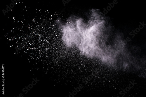 Explosion of white powder isolated on black background. Abstract colored background. holi festival.