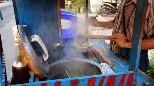 Indonesian food, mie ayam, noodles with chicken presented directly by the seller on the cart photo