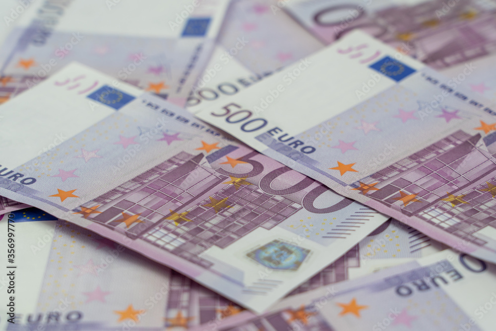 Banknotes of five hundred and 500 euros are scattered in a chaotic manner. European currency blank for design, background. Side view. Banknotes of five hundred and 500 euros are scattered in a chaotic manner. European currency blank for design, background. Side view.