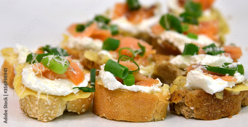 Sandwiches with red fish, cheese and greens onions Sandwiches with red fish, cheese and greens onions