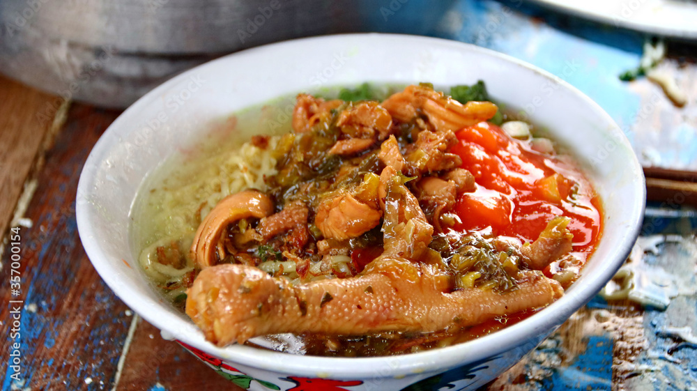 Indonesian food, mie ayam, noodles with chicken presented directly by the seller on the cart Indonesian food, mie ayam, noodles with chicken presented directly by the seller on the cart