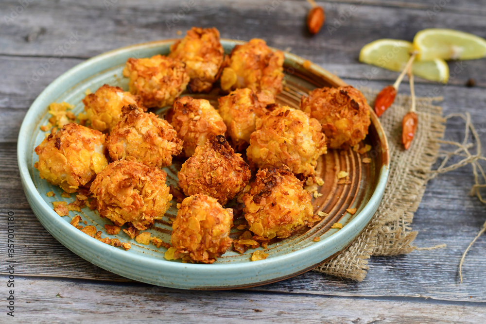 Home made Crispy Chicken Popcorn with honey mustard sauce on wooden background Home made Crispy Chicken Popcorn with honey mustard sauce on wooden background