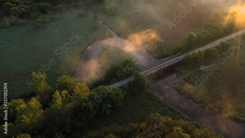 Aerial view of american countryside in the summertime. Sunrise  dawn  misty early morning. North american rural landscape   Beautiful nature of Midwest