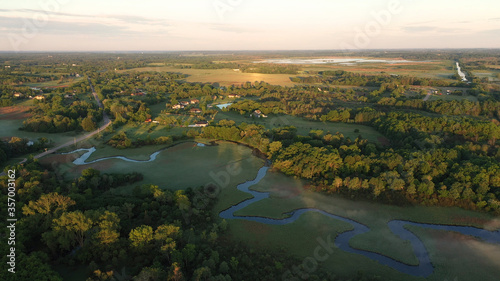 Aerial view of american countryside in the summertime. Sunrise, dawn, misty early morning. North american rural landscape,  Beautiful nature of Midwest