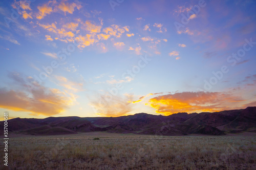 Morning in the steppe in a river valley. 5 minutes before sunrise. Beautiful Sunrise. Landscape in the steppe  Prairie.Morning landscape. The clouds.