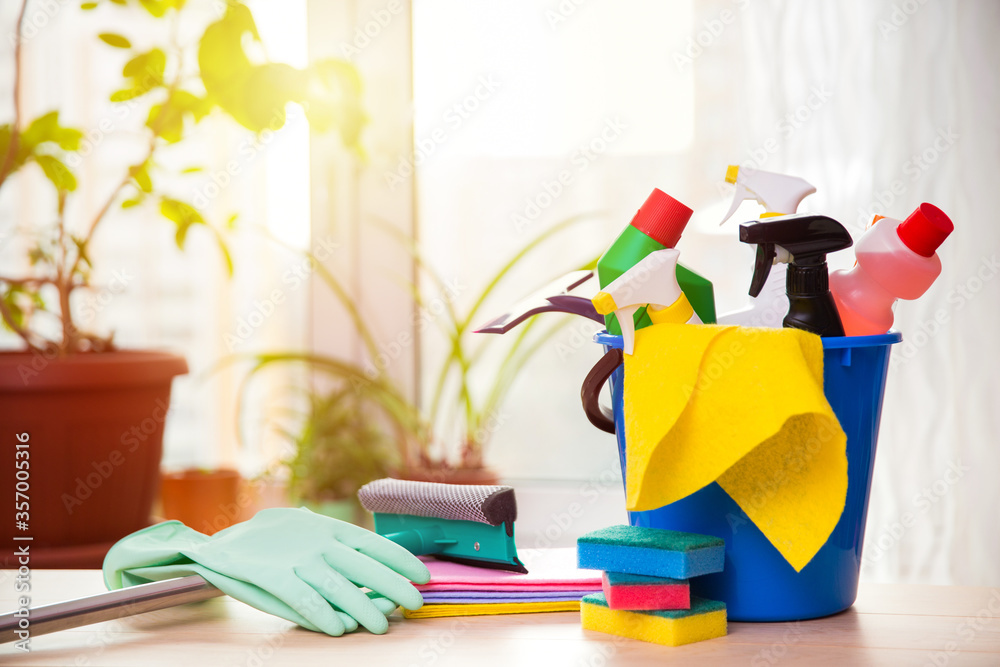 cleaning products: bottles, sprays etc, on window background cleaning products: bottles, sprays etc, on window background