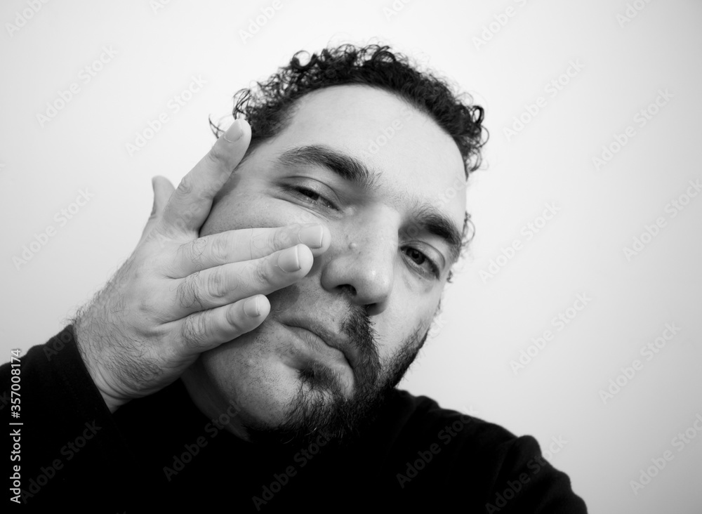 Close-up portrait of a handsome young man with brave manly face. Male beauty. Close-up portrait of a handsome young man with brave manly face. Male beauty.