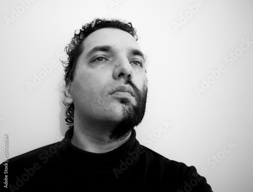 Close-up portrait of a handsome young man with brave manly face. Male beauty.