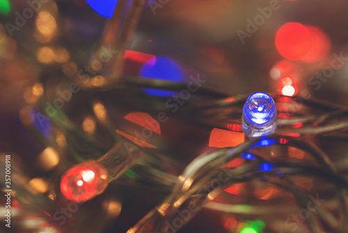 LED lights garland, colorful light bulbs on a bokeh background