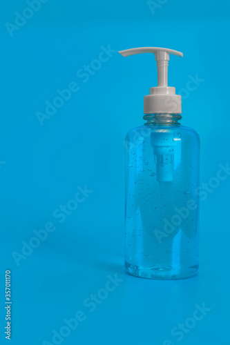 Covid-19 concept. Blue alcohol gel isolated on blue background. Hand sanitizer gel for clean. Hand sanitizer in pump head bottle. with copy space.