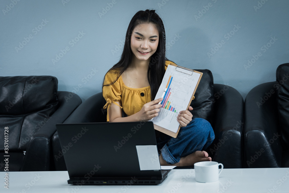 A young female university student presents her study through oline internet at home. A teenager woman spends time during covid-19 pandemic study online at home. Online and distance education concept. A young female university student presents her study through oline internet at home. A teenager woman spends time during covid-19 pandemic study online at home. Online and distance education concept.