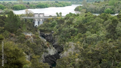 Aratiatia Dam in New Zealand releasing water, creating a series of waterfalls. photo